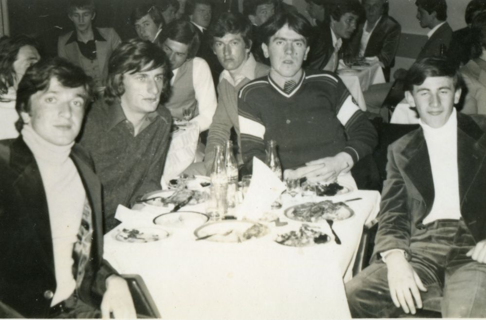 A group of teenage boys sitting around a table, with more people their age seated at other tables in the background, from the personal archive of Mr Edin Vejzovic (scanned in July 2017 in Bosnia and Hercegovina)