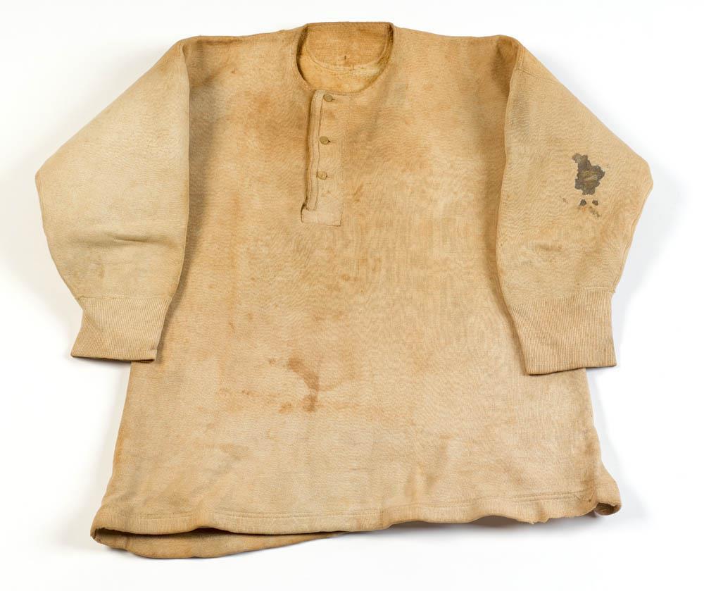 James Connolly’s vest marked with a bloodstain from one of the wounds he received during the 1916 Rising.
This image is reproduced with the kind permission of the National Museum of Ireland (HE:EWL.292.2).