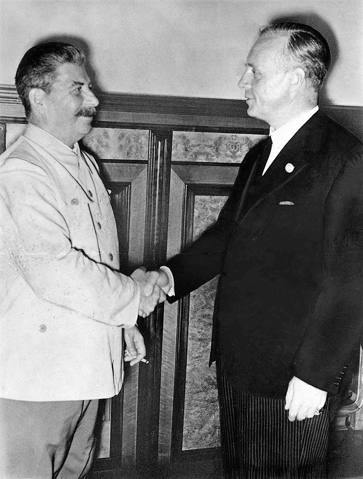 Stalin and Ribbentrop shaking hands after the signing of the pact in the Kremlin, August 1939.